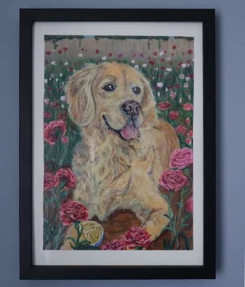 The finished, framed dog portrait hanging on a wall